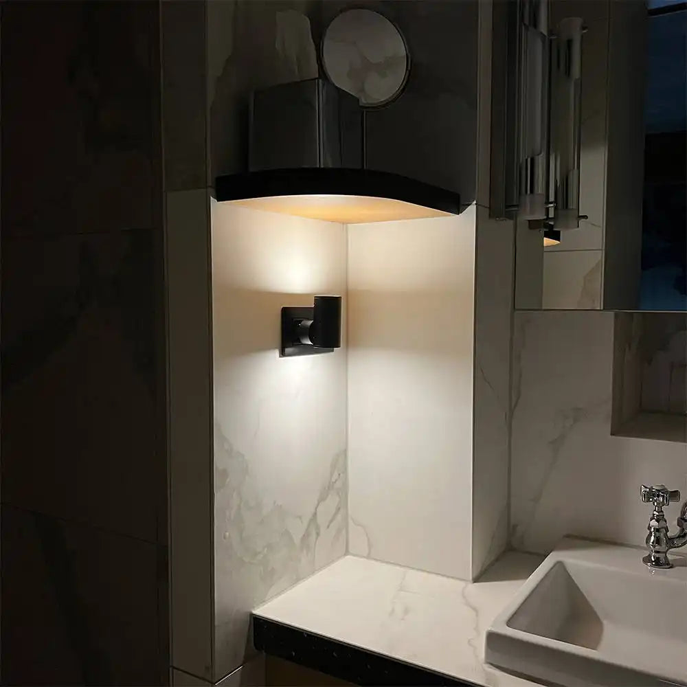 A modern bathroom sink and vanity with integrated lighting.